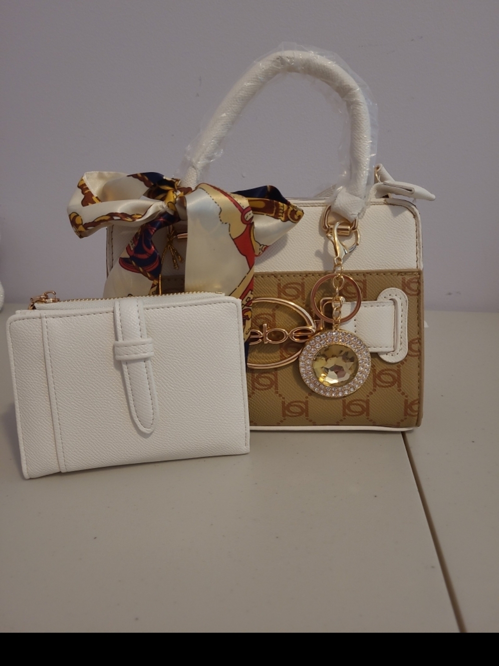 White & Tan Bebe Cross Body Bag with Scarf and Gold Charm